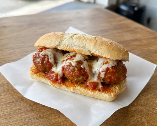 Meatball sub with tomato sauce and melted mozzarella